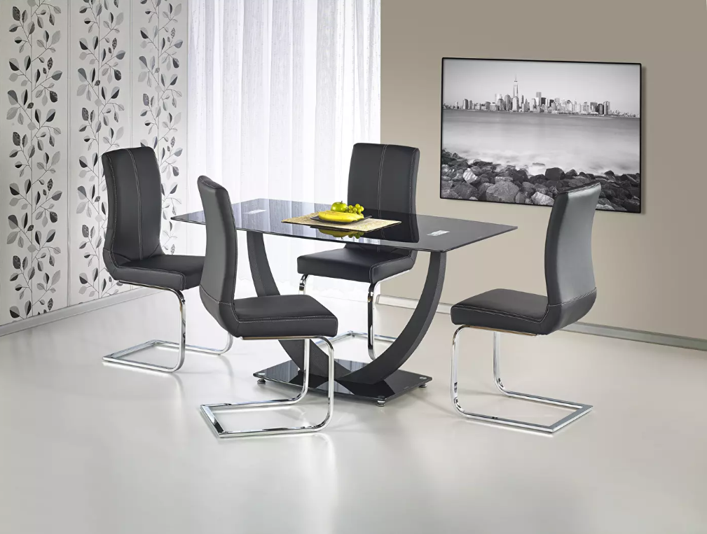 Blagovaonski stol Anton je dizajnerski komad namještaja izrađen od stakla i lakiranog čelika. Dostupan je u crnoj boji i može smjestiti do 6 osoba.